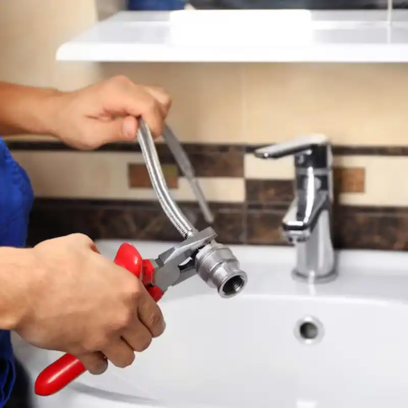 plumber-fixing-water-flexible-hose-bathroom plumber-fixing-water-flexible-hose-bathroom